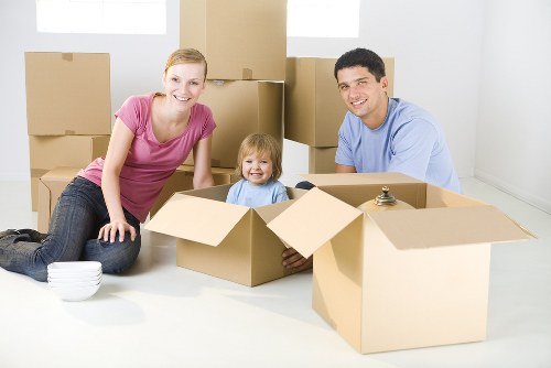 Team member safely loading furniture into a moving van