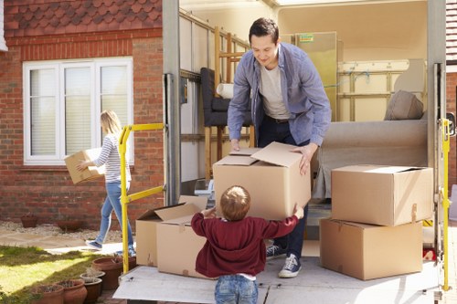 Local movers loading furniture into a van in South Kensington