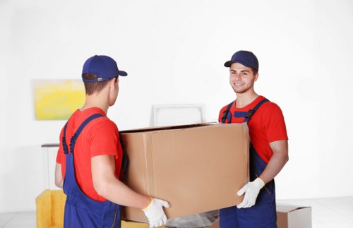 Removal van and moving team in a South Kensington residential street