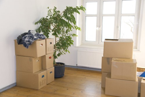 Professional movers handling furniture in a South Kensington apartment building