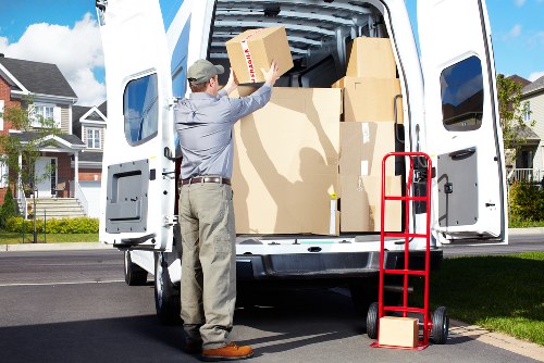 Packing and loading items into a moving van in South Kensington