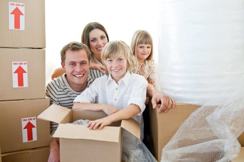 Removal team planning a move in South Kensington with packed boxes and furniture